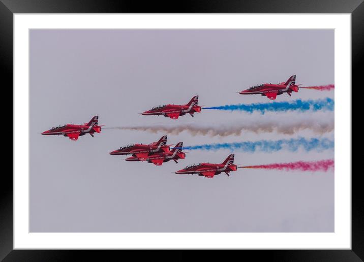Red Arrows with coloured smoke on at Duxford Framed Mounted Print by Clive Wells