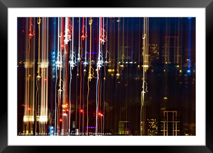 City life of dazzling lights and colors Framed Mounted Print by Andis Atvars