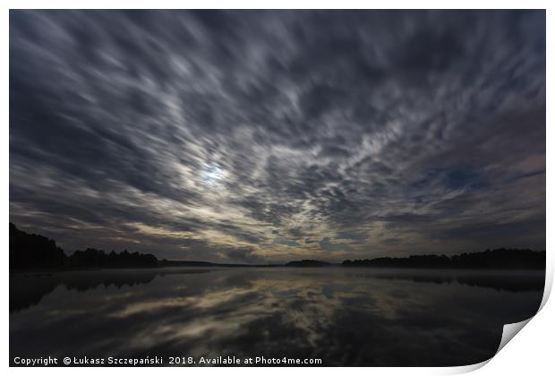 Dynamic clouds in the night over the lake lit by f Print by Łukasz Szczepański