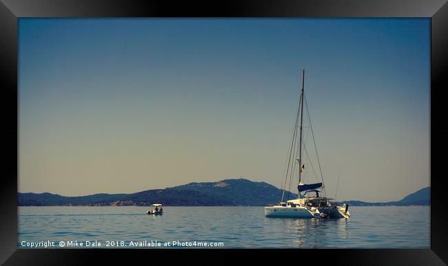                      A white yacht moored off Paxo Framed Print by Mike Dale