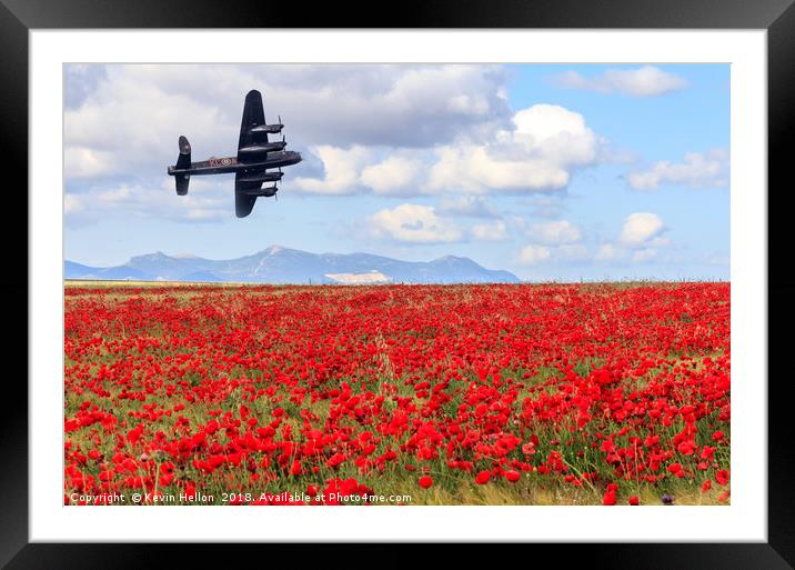 Lancaster bomber passing over a field of poppies Framed Mounted Print by Kevin Hellon