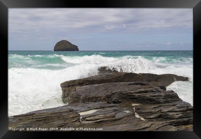 Waves crashing over rocks with Gull rock in the di Framed Print by Mark Roper