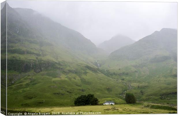 Foggy view of the Scottish Highlands in Glen Coe Canvas Print by Angela Bragato