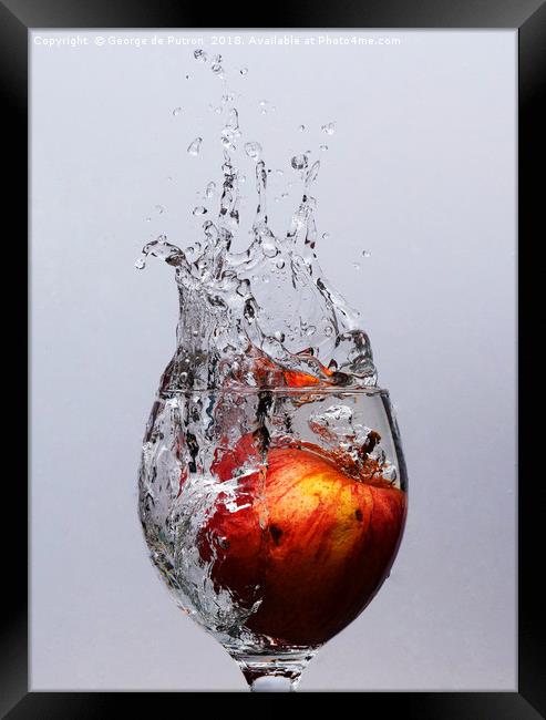 Apple Splash Framed Print by George de Putron