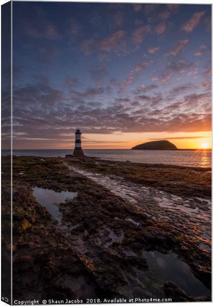 Penmon lighthouse at sunrise  Canvas Print by Shaun Jacobs