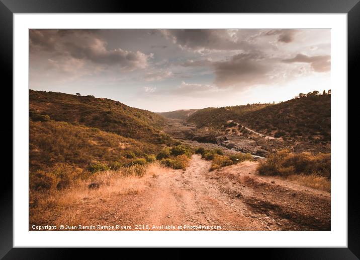 Very steep dirt road that leads to the Guadiana Ri Framed Mounted Print by Juan Ramón Ramos Rivero
