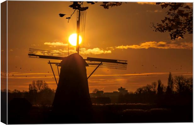 Windmill at the warm and red color sunrise Canvas Print by Ankor Light