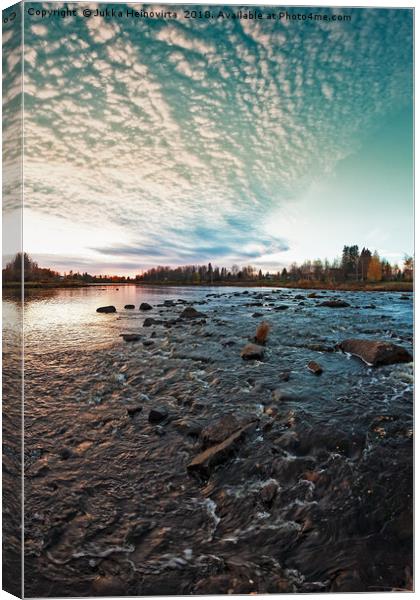 Sunset Over The River Rocks Canvas Print by Jukka Heinovirta