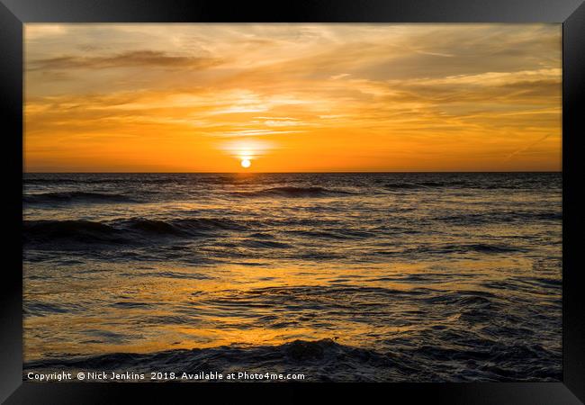 The Sun Setting over Llantwit Major Beach Glamorga Framed Print by Nick Jenkins