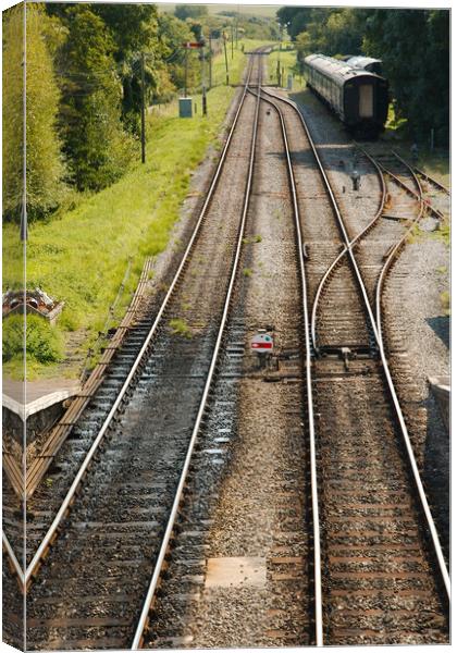 Railway tracks disappearing into the distance Canvas Print by Simon J Beer