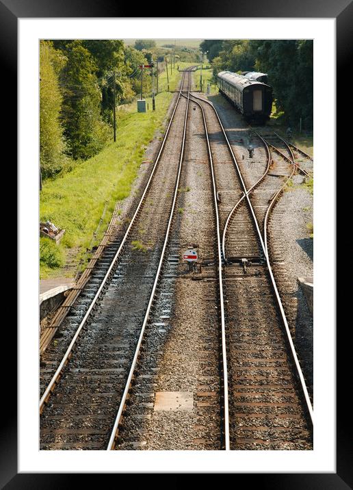 Railway tracks disappearing into the distance Framed Mounted Print by Simon J Beer