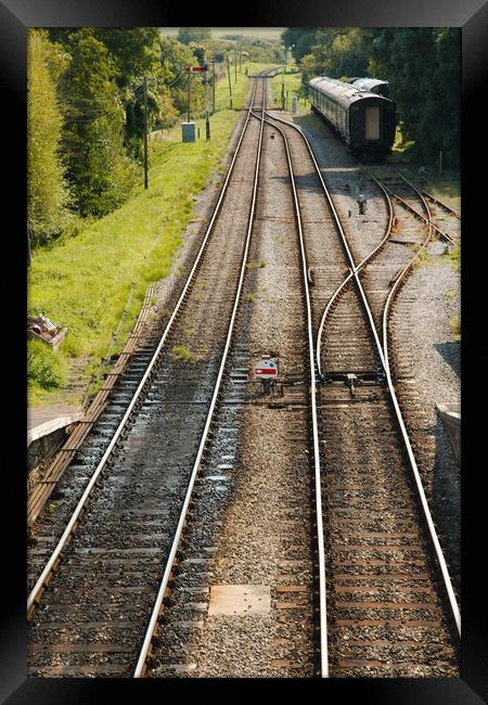 Railway tracks disappearing into the distance Framed Print by Simon J Beer