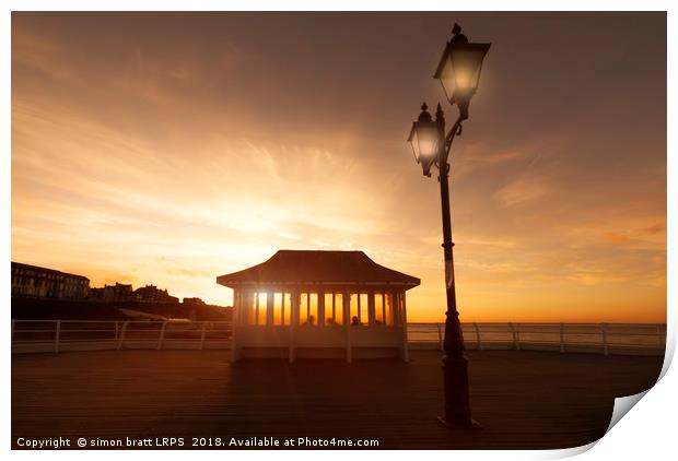 Cromer pier Norfolk shelter at sunset Print by Simon Bratt LRPS