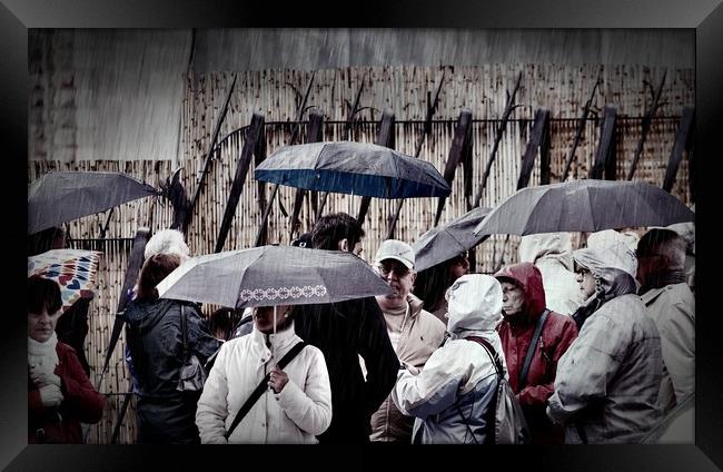 People in Rain Framed Print by Darryl Brooks