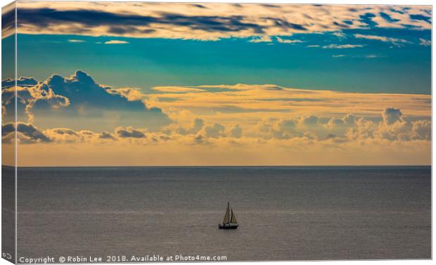 A lone sailing boat at sunrise  Canvas Print by Robin Lee