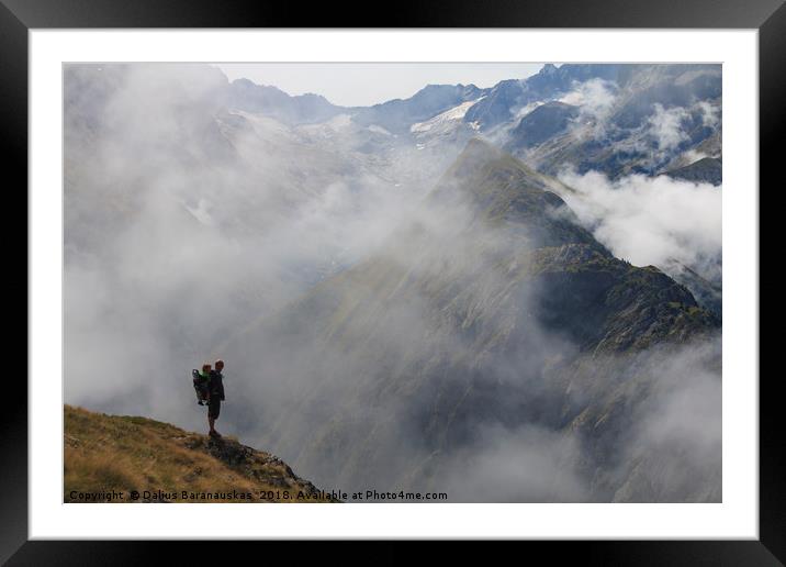 Hiker in France alps standing on edge of mountain  Framed Mounted Print by Dalius Baranauskas