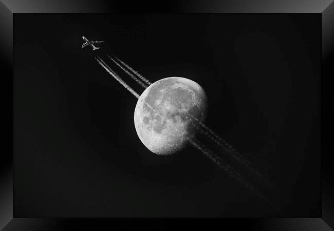 Plane Across the Moon Framed Print by Paul Appleby