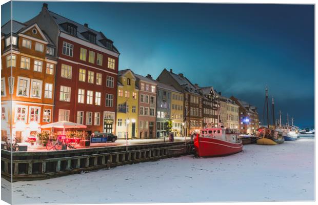 Frozen red ship in Nyhavn Copenhagen canal Canvas Print by Dalius Baranauskas