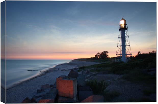 Pape's lighthouse in calm sunset Canvas Print by Dalius Baranauskas