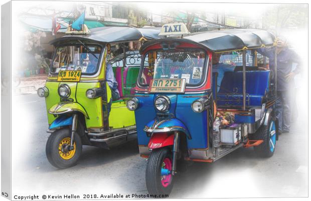 Tuk tuks and their drivers  Canvas Print by Kevin Hellon
