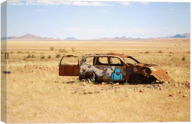 Abandoned car somewhere in Namibia Canvas Print by Damien Zasikowski