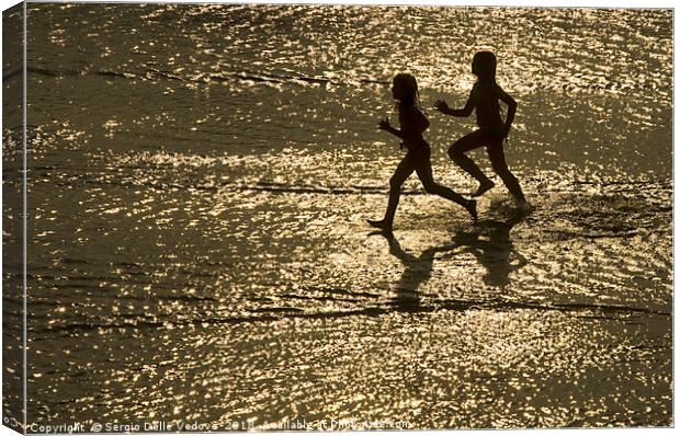two children run by the sea Canvas Print by Sergio Delle Vedove