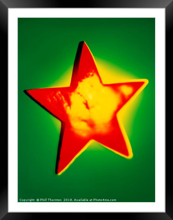 Shining star Christmas decoration. Framed Mounted Print by Phill Thornton