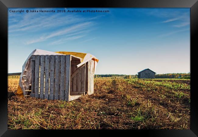Fallen Crates On An Autumn Field Framed Print by Jukka Heinovirta