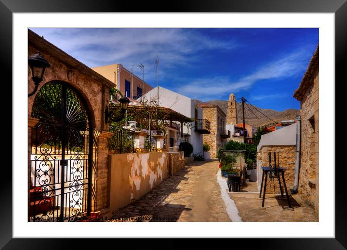 Between the Houses in Halki Framed Mounted Print by Tom Gomez