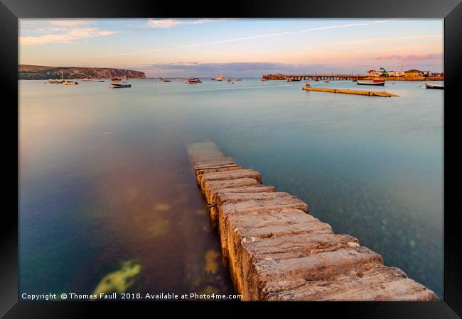 Stone jetty in Swanage Harbour Framed Print by Thomas Faull