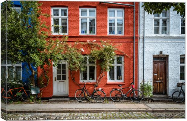 Picturesque colorful houses in Copenhagen Canvas Print by Juan Jimenez