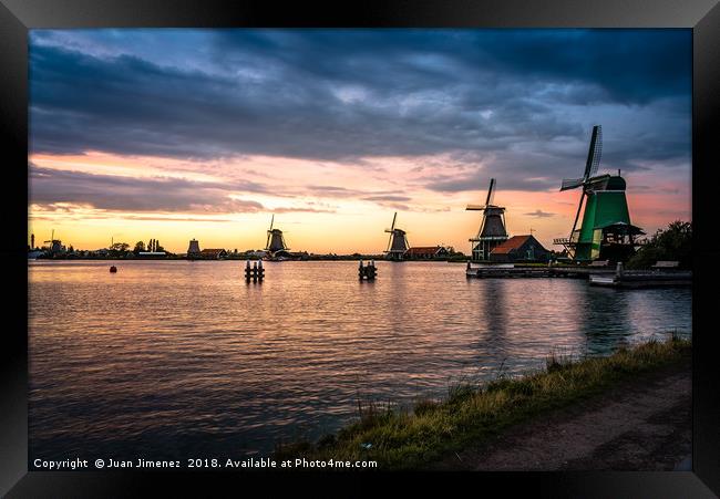 Sunset at windmills in Zaanse Schans Framed Print by Juan Jimenez