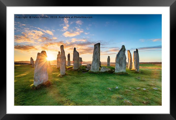 Stunning sunset over the Callanish stone circle on Framed Mounted Print by Helen Hotson