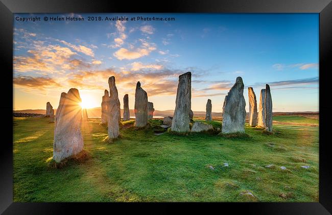 Stunning sunset over the Callanish stone circle on Framed Print by Helen Hotson