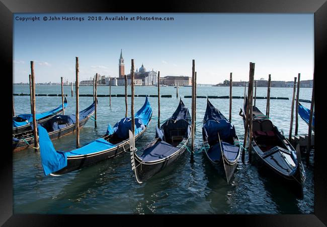 Serene Venice Canal Scene Framed Print by John Hastings