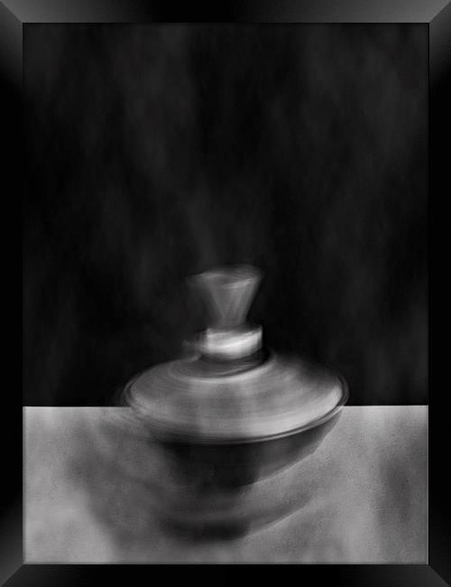 Smoking Spinning Top Framed Print by Neil Greenhalgh