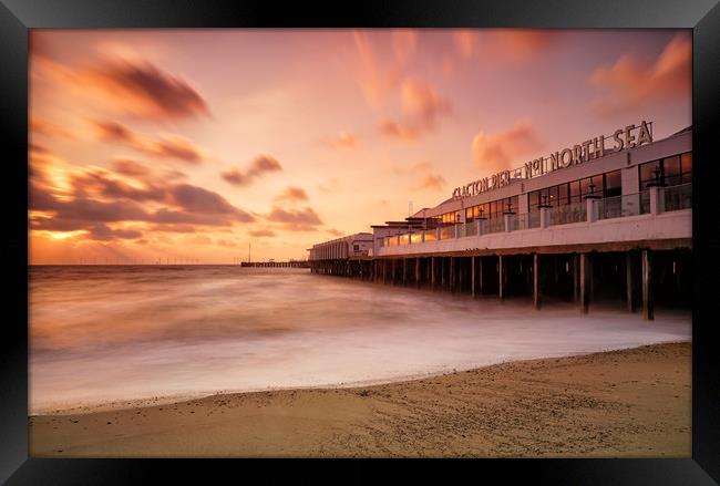 Clacton on Sea Pier at sunrise Framed Print by Rob Woolf