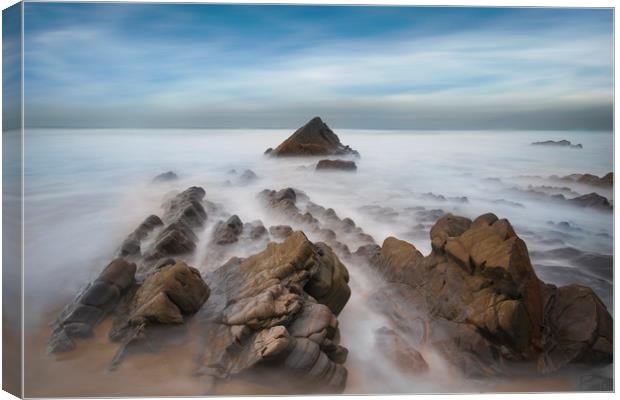 jagged rocks and smooth sea's at Sandymouth beach Canvas Print by Eddie John