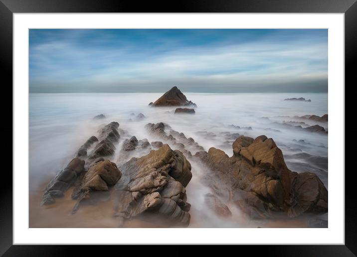 jagged rocks and smooth sea's at Sandymouth beach Framed Mounted Print by Eddie John