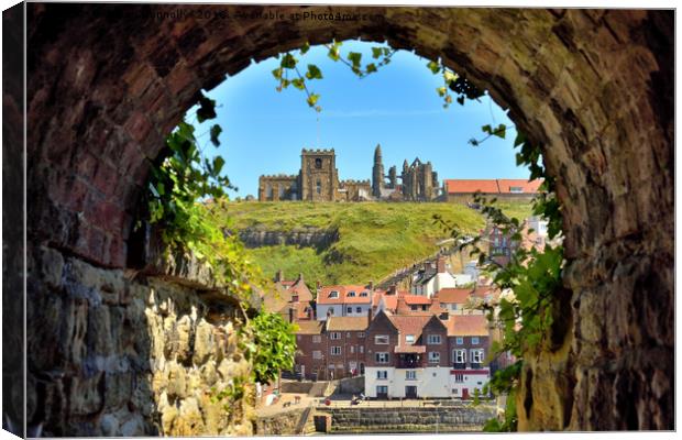 Whitby Abbey through The Arch Canvas Print by Jason Connolly