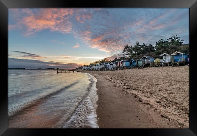 Beach huts at sunrise on beautiful Wells beach Framed Print by Gary Pearson