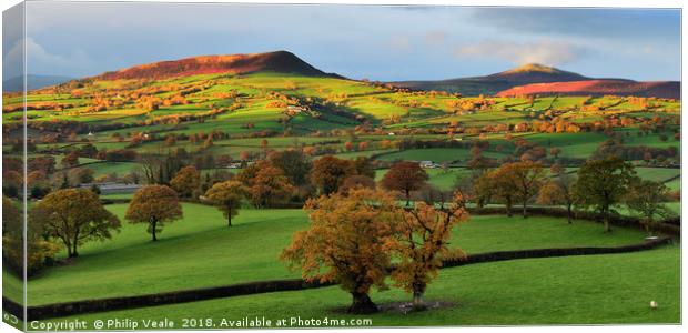 Skirrid and Sugar Loaf in Autumn's First Light. Canvas Print by Philip Veale