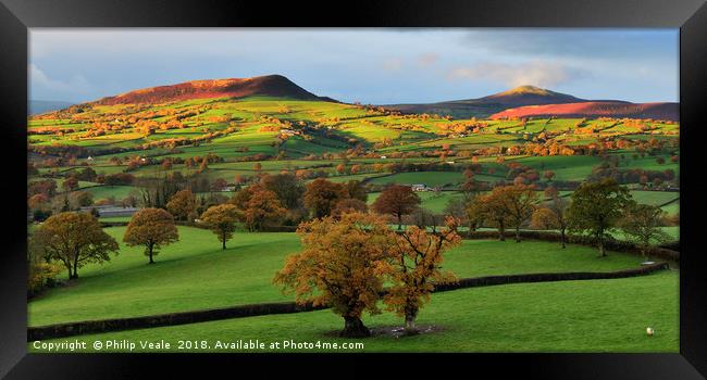 Skirrid and Sugar Loaf in Autumn's First Light. Framed Print by Philip Veale