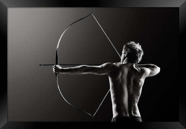 Male archer drawing long bow Framed Print by Johan Swanepoel