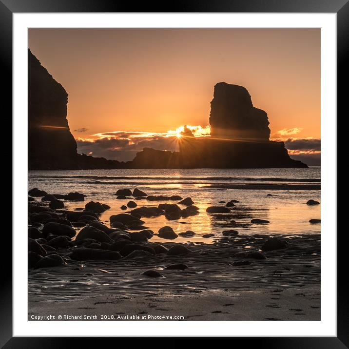 Setting sun beyond the seastack at Talisker Point Framed Mounted Print by Richard Smith