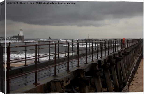 The Old Wooden Pier on a stormy morning Canvas Print by Jim Jones