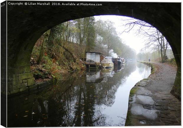 Under the bridge on a misty day at Hebden Bridge. Canvas Print by Lilian Marshall