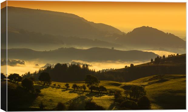 Dawn - looking towards Castell Dinas Bran Canvas Print by Clive Ashton