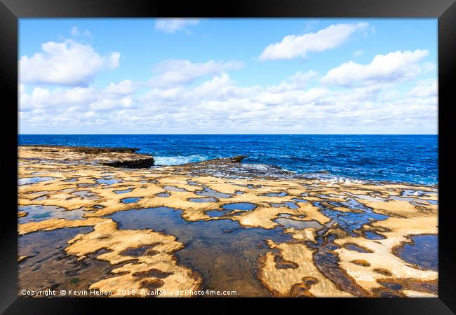 Looking out to sea over the rock pools Framed Print by Kevin Hellon