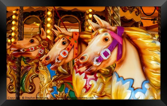 Three colourful hand painted carousel horses Framed Print by Stephen Robinson